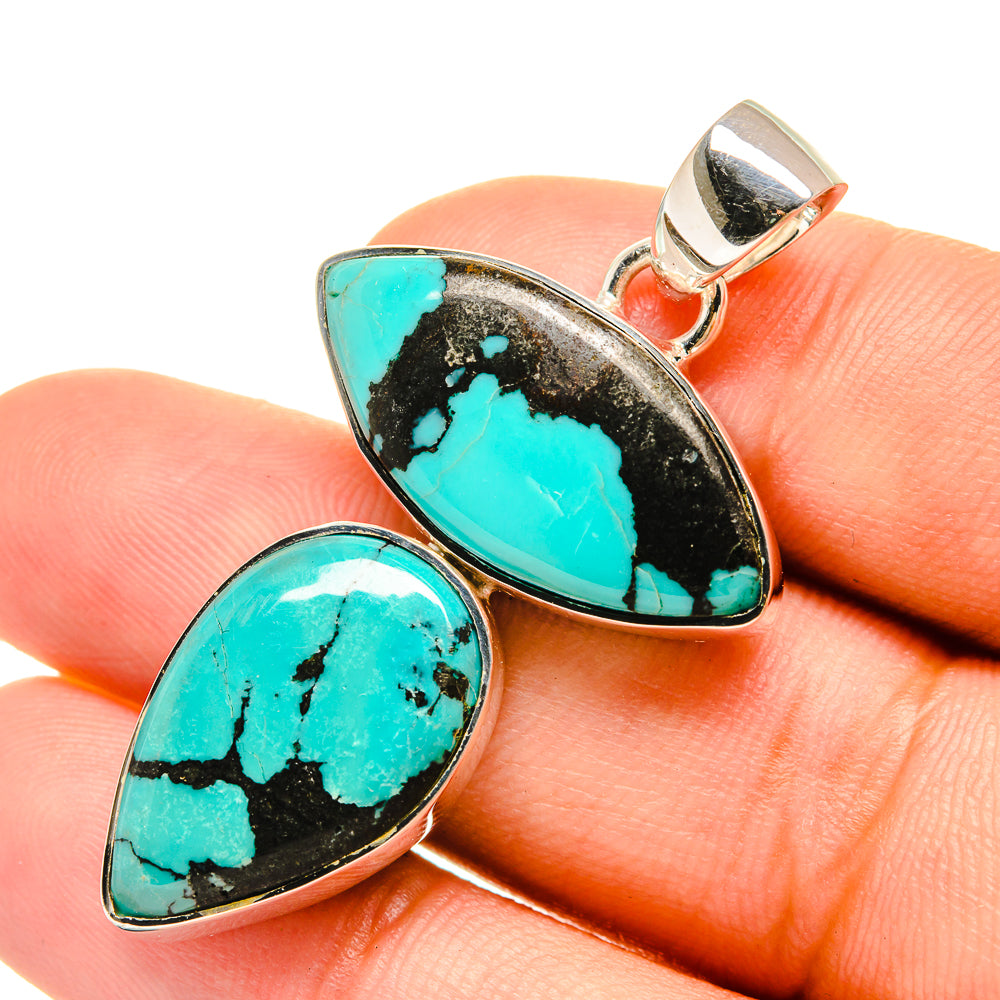 Sterling silver turquoise pendant with two teardrop cabochons, one on top