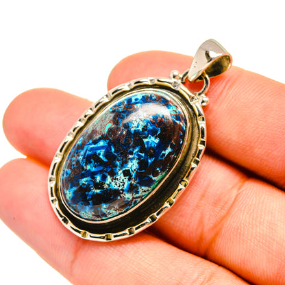 Oval shattuckite gemstone pendant in sterling silver bezel, blue and black stone cabochon