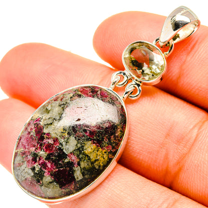 Oval multicolor gemstone pendant in sterling silver with round green stone connector