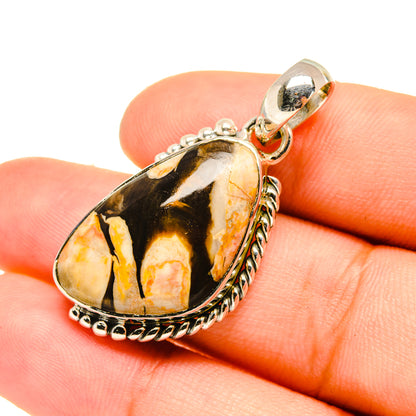 Oval peanut wood jasper pendant in sterling silver, with round bail close-up