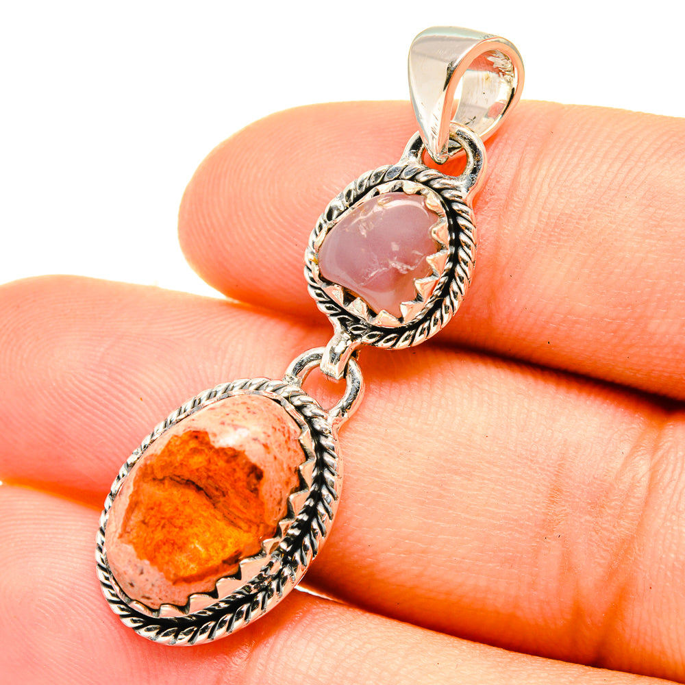 Sterling silver pendant with orange oval and pink oval cabochon gemstones