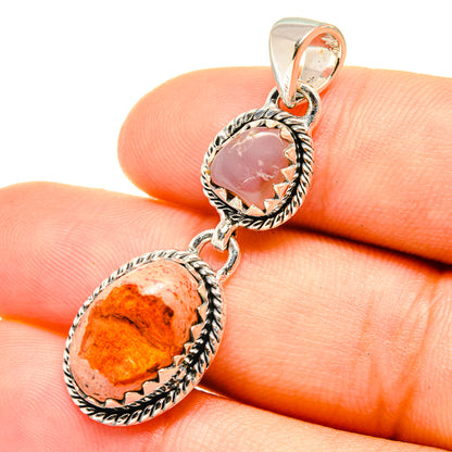 Sterling silver pendant with orange oval and pink oval cabochon gemstones