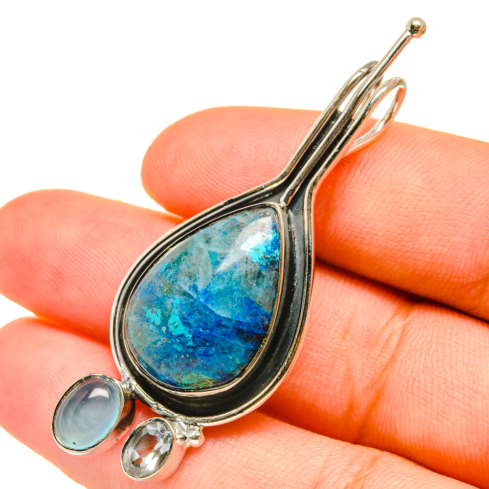 Sterling silver pendant on open bail with teardrop blue aqua gemstone and 3 small stones