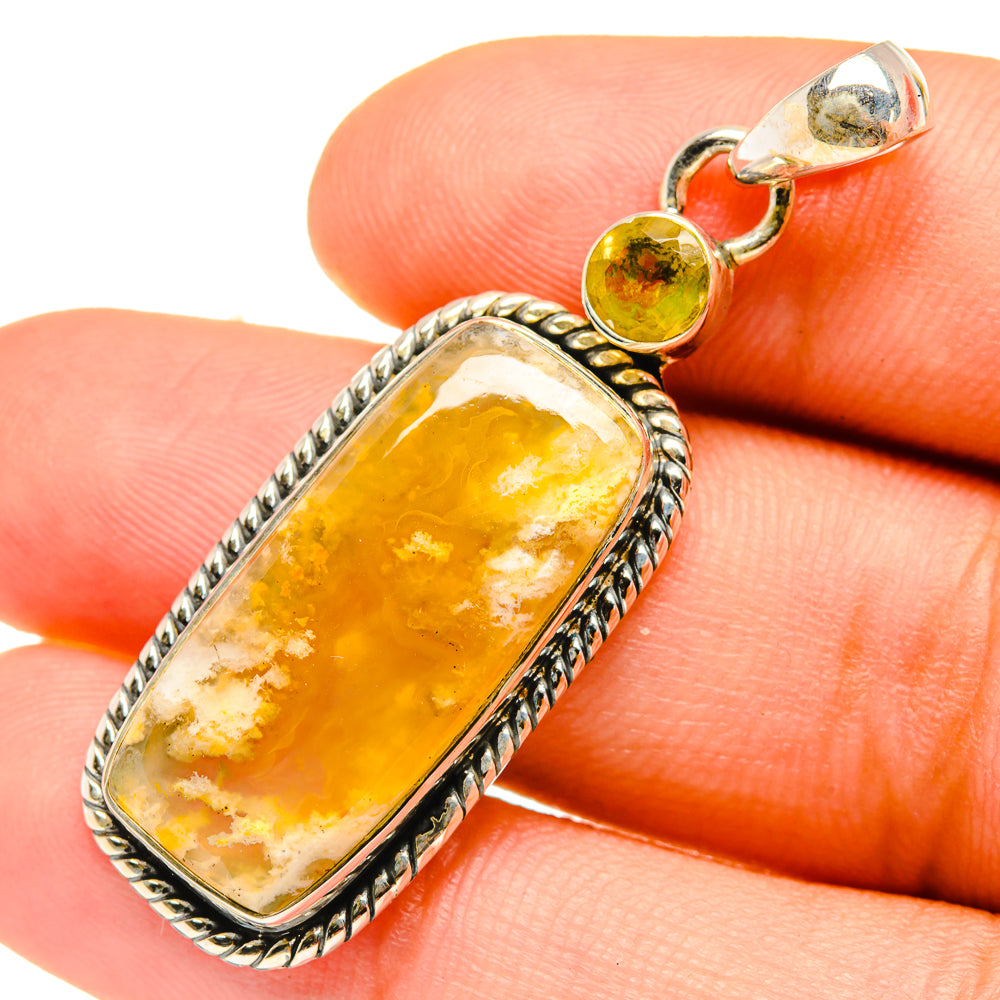 Citrine agate pendant in textured silver bezel, shown close on hand with round stone cap
