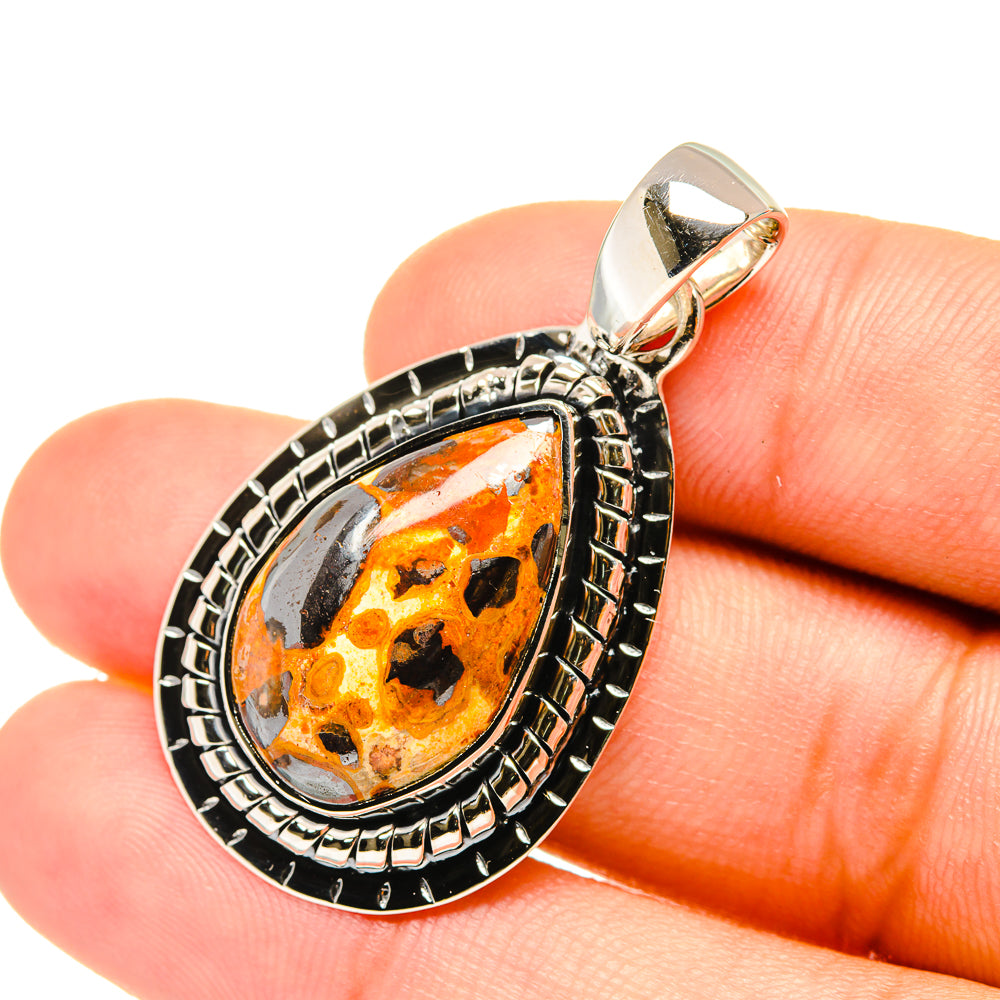 Sterling silver bauxite pendant with teardrop orange stone, ornate bezel, and bail loop