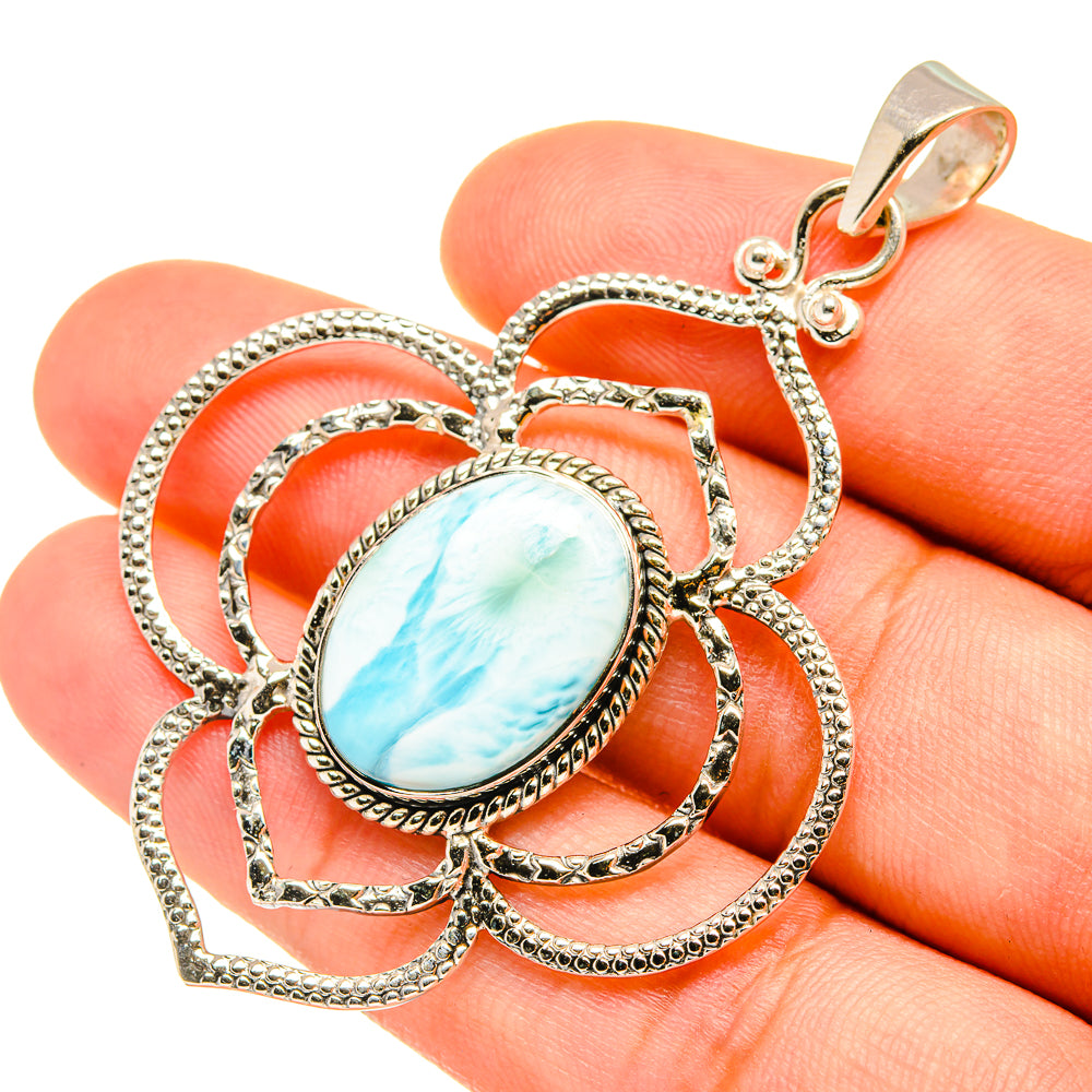 Oval larimar-style gemstone sterling silver pendant with ornate braided frame