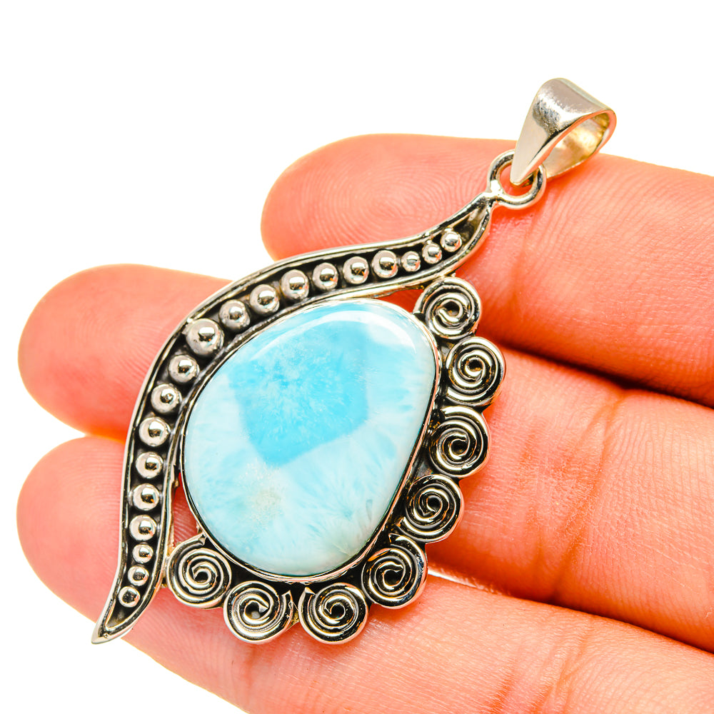 Larimar teardrop pendant in ornate sterling silver scroll frame