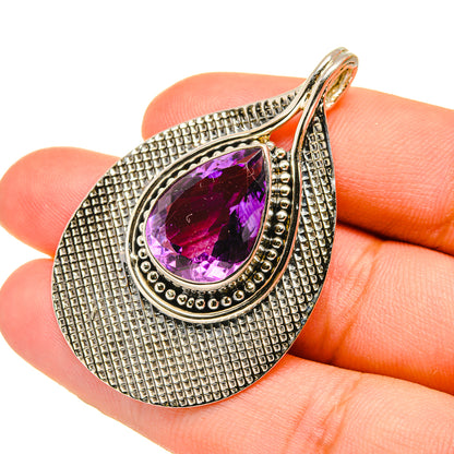 Sterling silver teardrop pendant with faceted amethyst gemstone