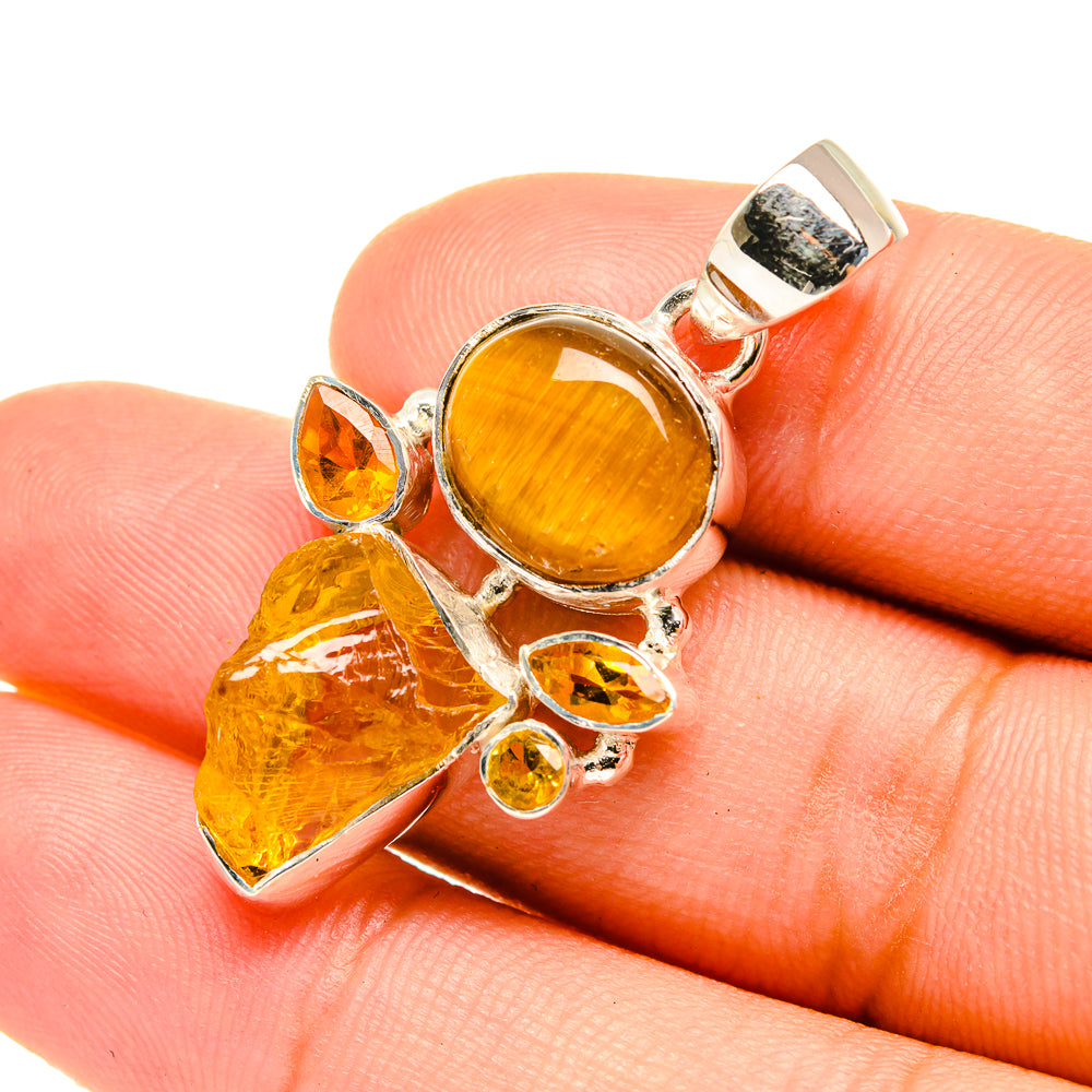 Amber gemstone pendant in sterling silver, round center with rough crystal accents