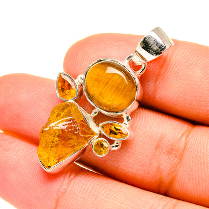 Amber gemstone pendant in sterling silver, round center with rough crystal accents