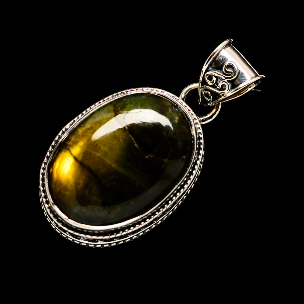 Oval labradorite pendant with silver frame and ornate top bail