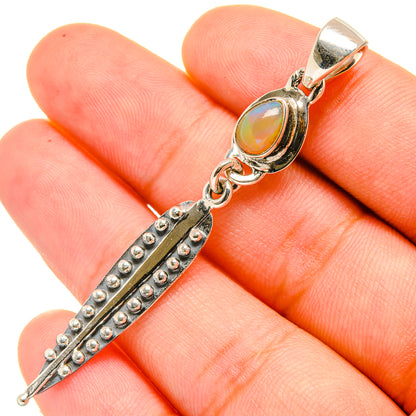 Sterling silver opal pendant with oval yellow stone and studded geometric drop