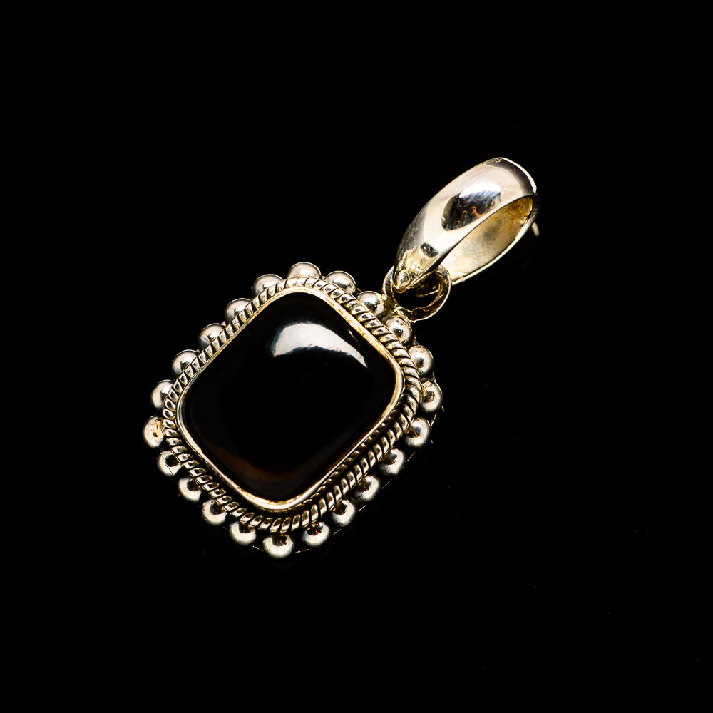 Smoky quartz pendant in silver bezel with round beaded rope border and loop bail