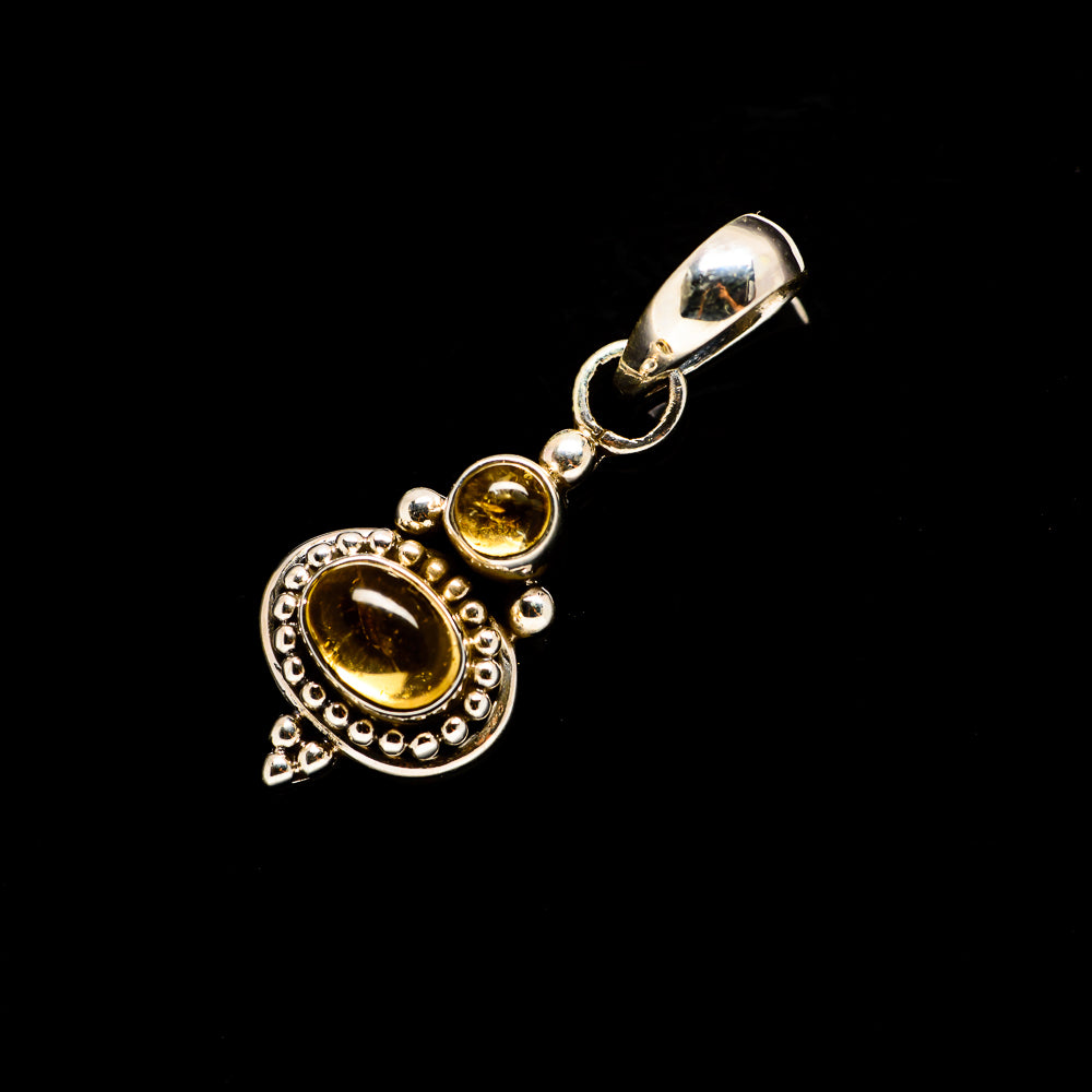 Golden citrine oval pendant in 925 sterling silver with beaded halo and ring bail