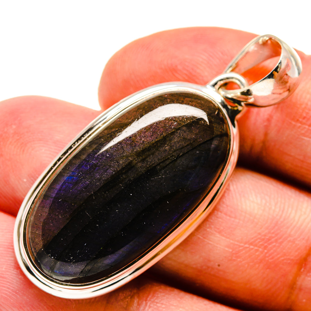 Oval labradorite pendant in 925 sterling silver bezel, dark blue-purple flash, close-up