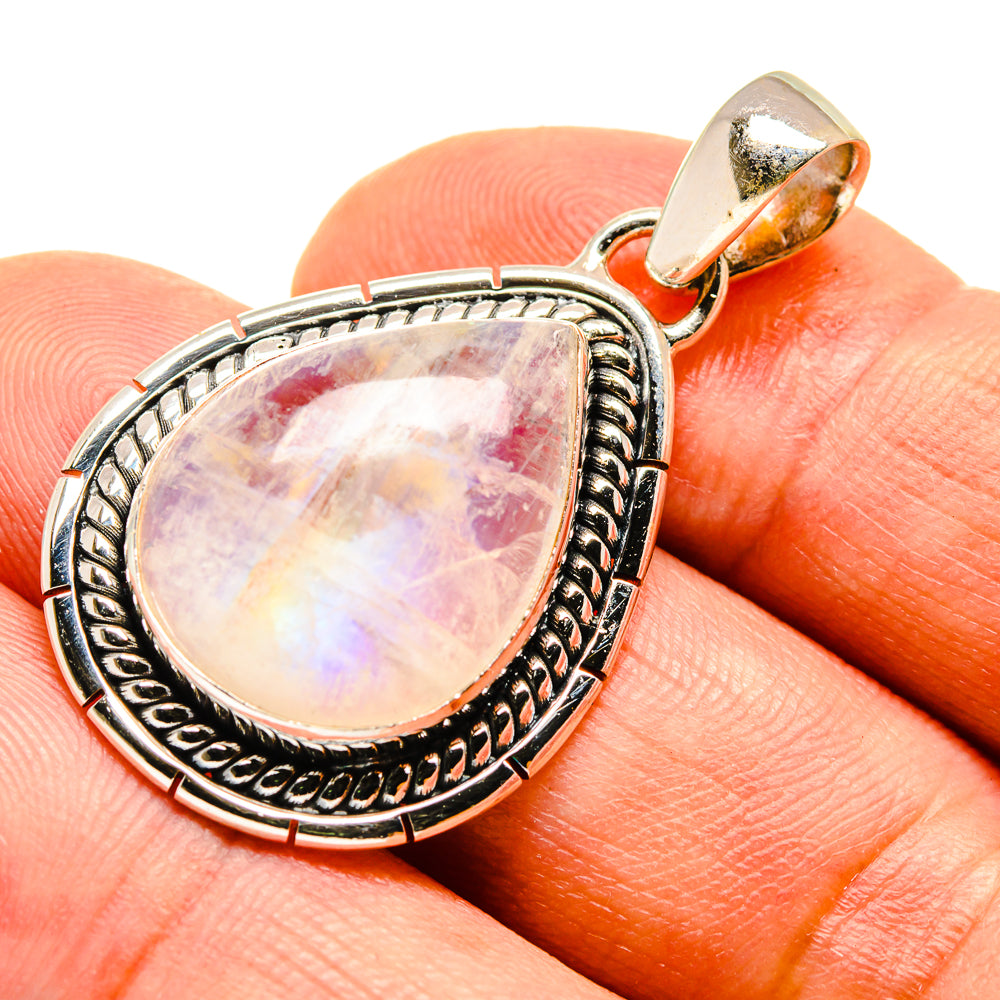 Teardrop moonstone pendant in 925 sterling silver with ornate bezel, pink-purple opalescence