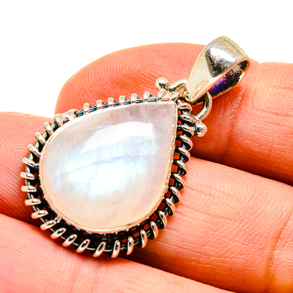 Sterling silver moonstone teardrop pendant with scalloped halo and rainbow iridescence