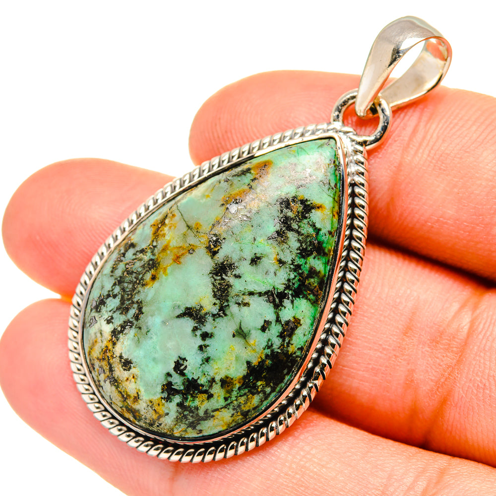 Teardrop turquoise pendant in 925 sterling silver with textured beaded edge, bail on top