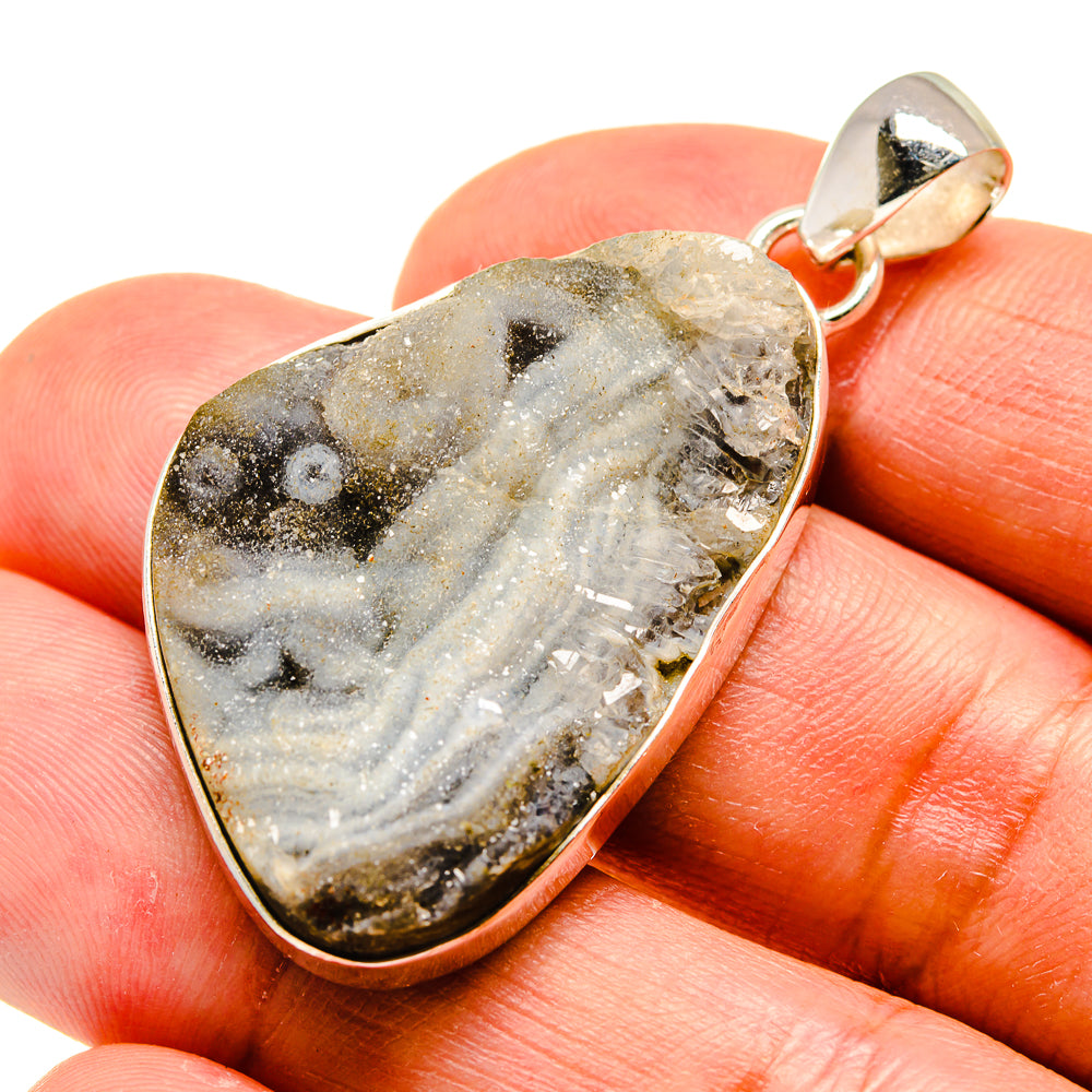 Sterling silver druzy pendant with teardrop cutout and gold-gray crystal texture