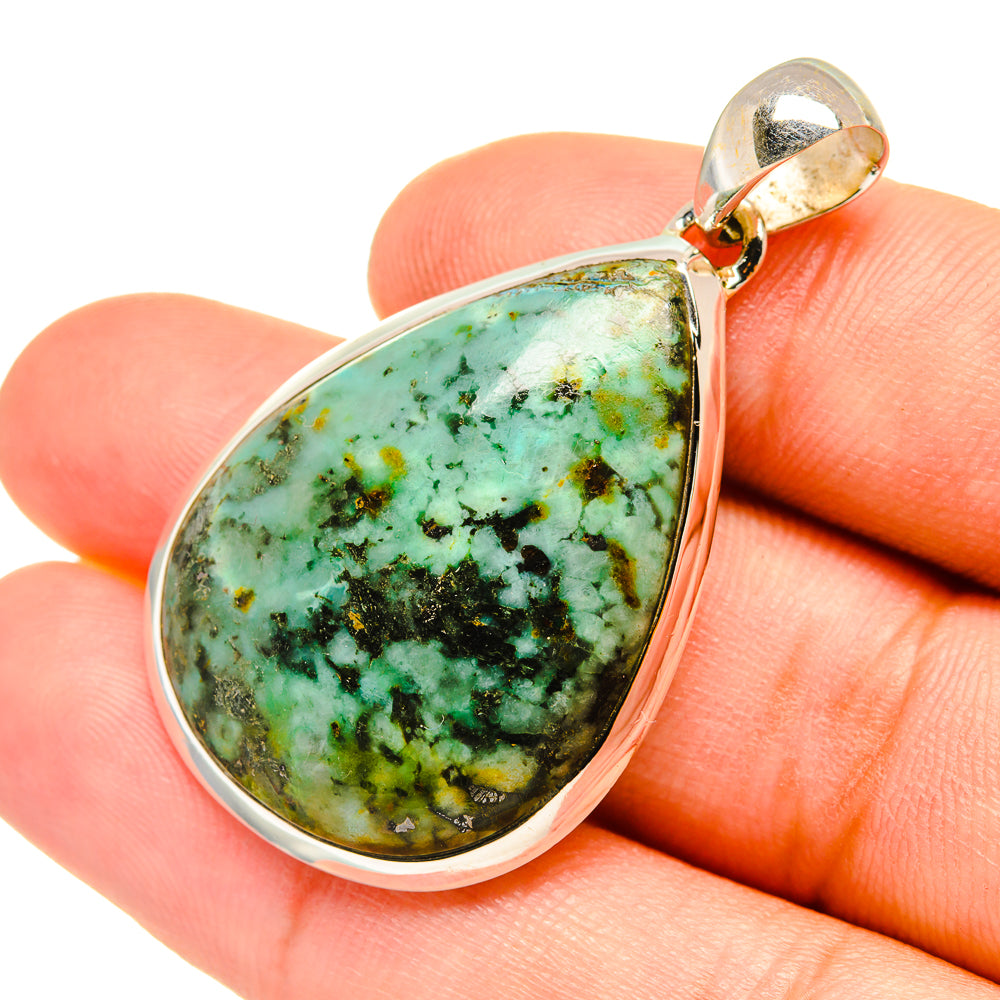 Teardrop turquoise pendant with green veined stone set in sterling silver bail