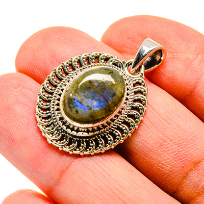 Sterling silver oval labradorite pendant with ornate filigree halo and loop bail