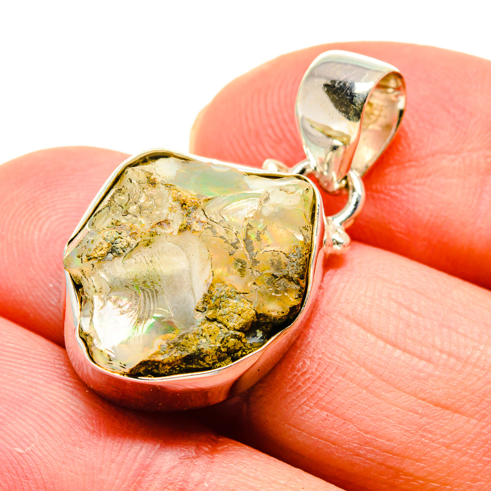 Rough yellow opal pendant close-up with 925 silver bezel and loop bail