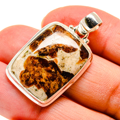 Sterling silver muscovite pendant with rectangular amber-brown stone and bail