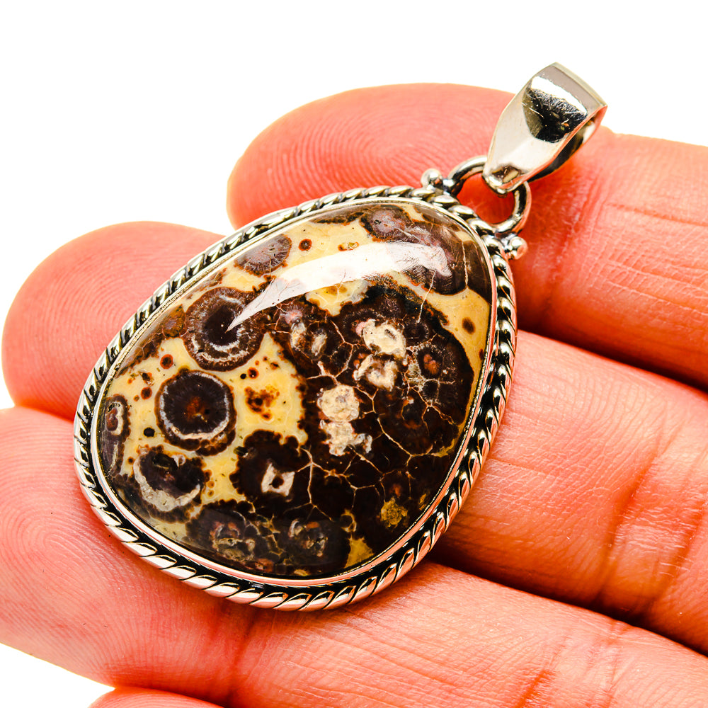 Oval jasper pendant with loop bail, dark brown and amber mottled pattern in silver setting