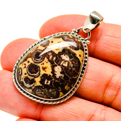 Oval jasper pendant with loop bail, dark brown and amber mottled pattern in silver setting