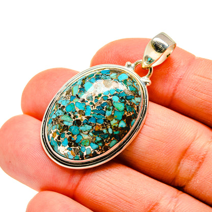 Oval turquoise mosaic pendant with gold bail and silver frame