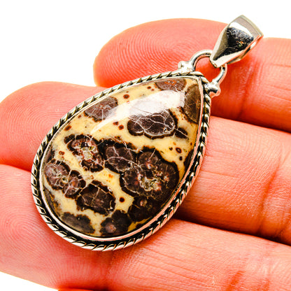 Teardrop jasper pendant with silver bezel and bail; mottled brown and cream stone