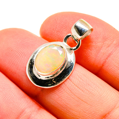Sterling silver opal pendant with oval opal cabochon bezel setting