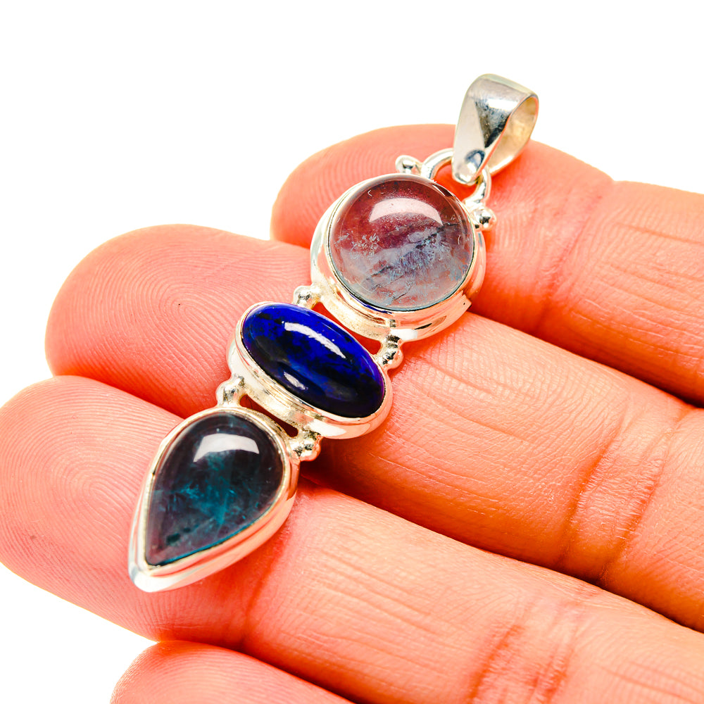 Sterling silver pendant with red, teal, and blue cabochon gemstones