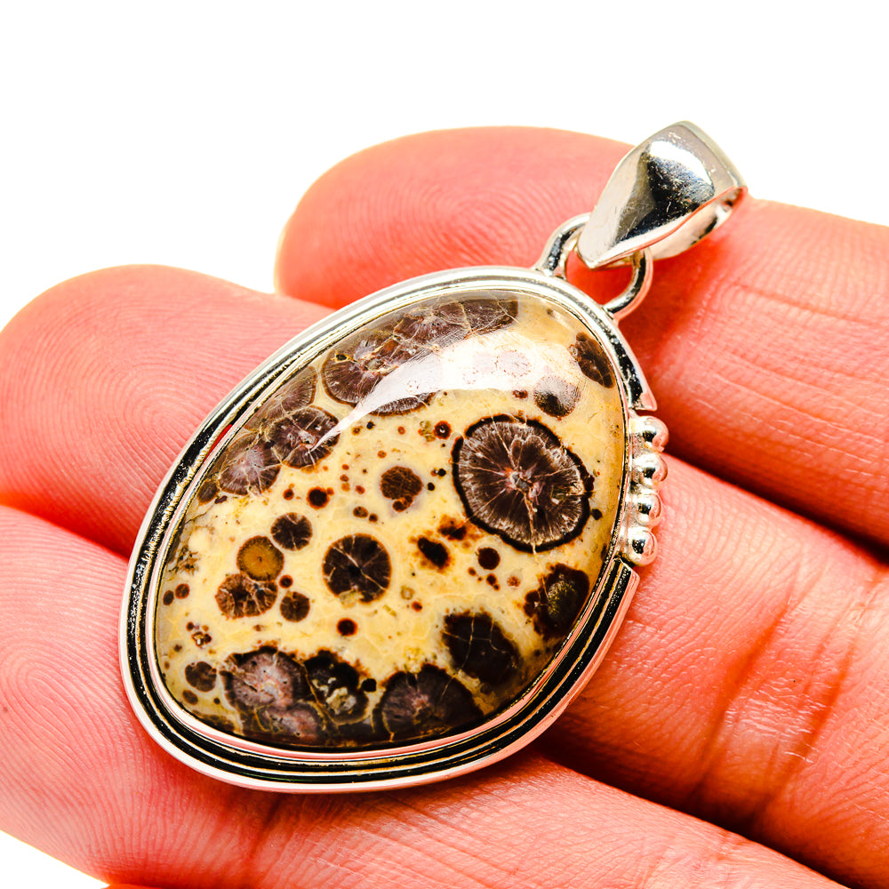 Oval Poppy Jasper pendant, sterling silver frame and bail, speckled stone close-up