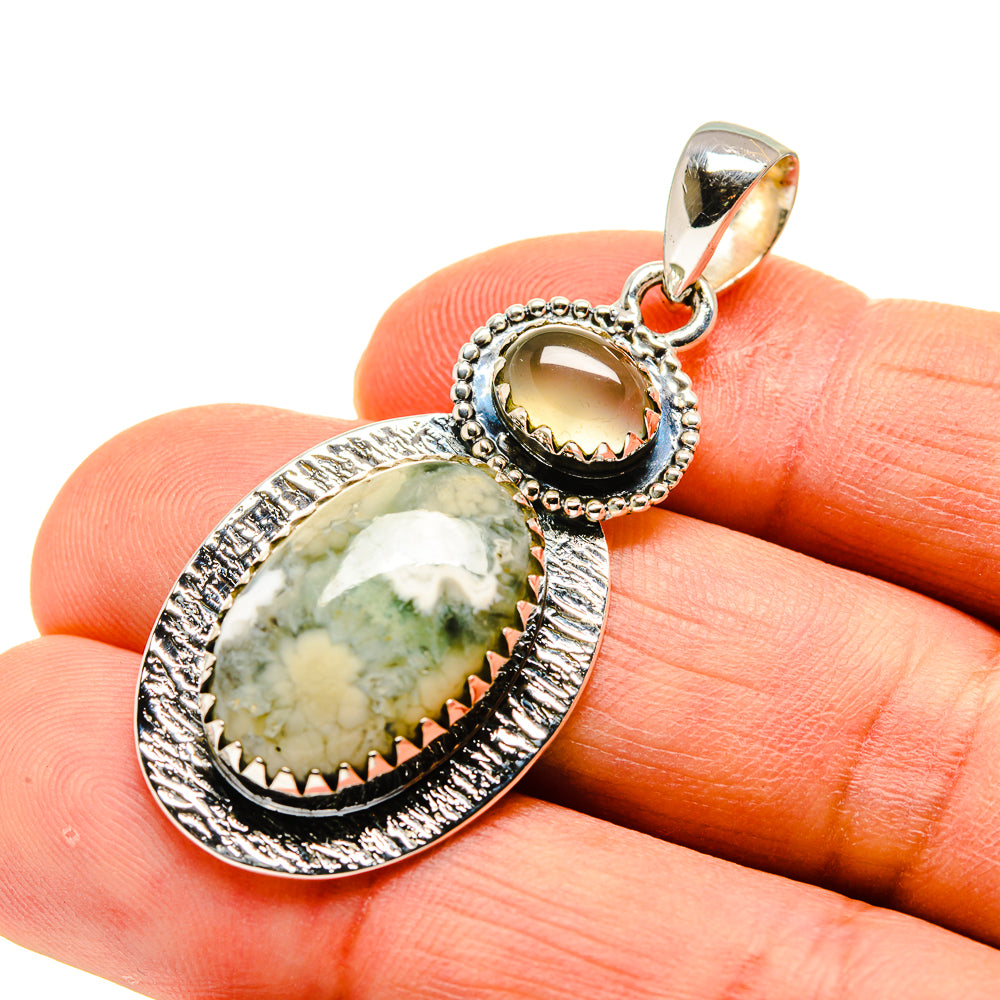 Sterling silver pendant bail with oval green-yellow cabochons and beaded border