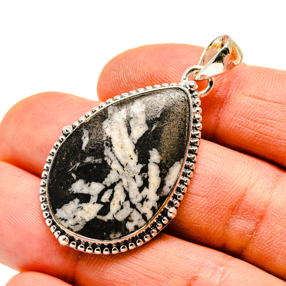 Sterling silver teardrop pendant with black-and-white druzy stone, top bail