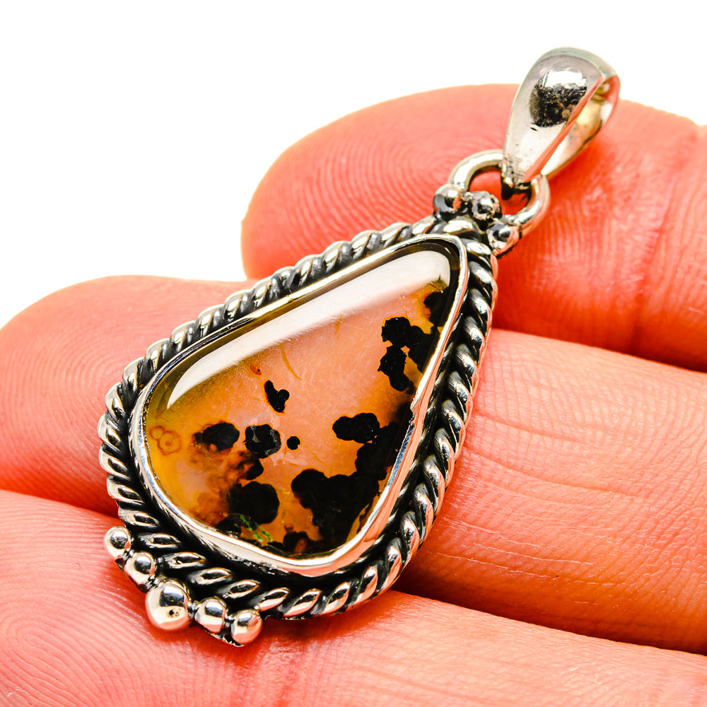 Sterling silver agate pendant with teardrop amber stone and black speckles