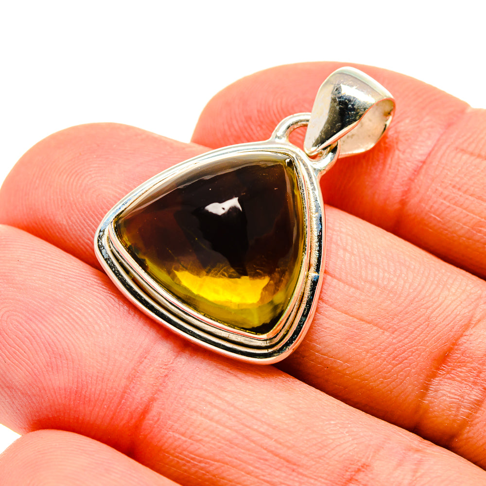 Sterling silver pendant with olive-green triangular cabochon and loop bail