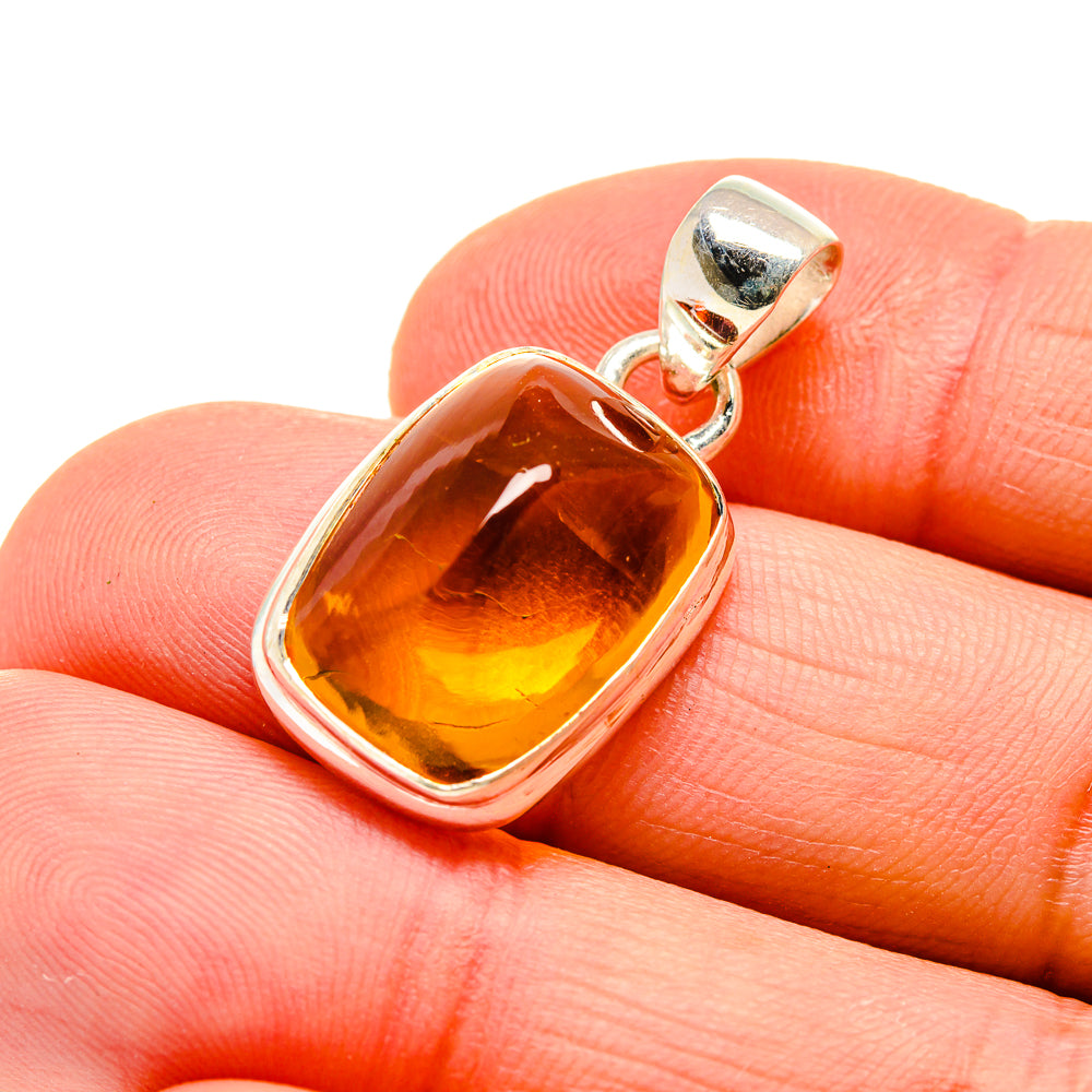 Citrine gemstone pendant in sterling silver with square amber stone, close-up