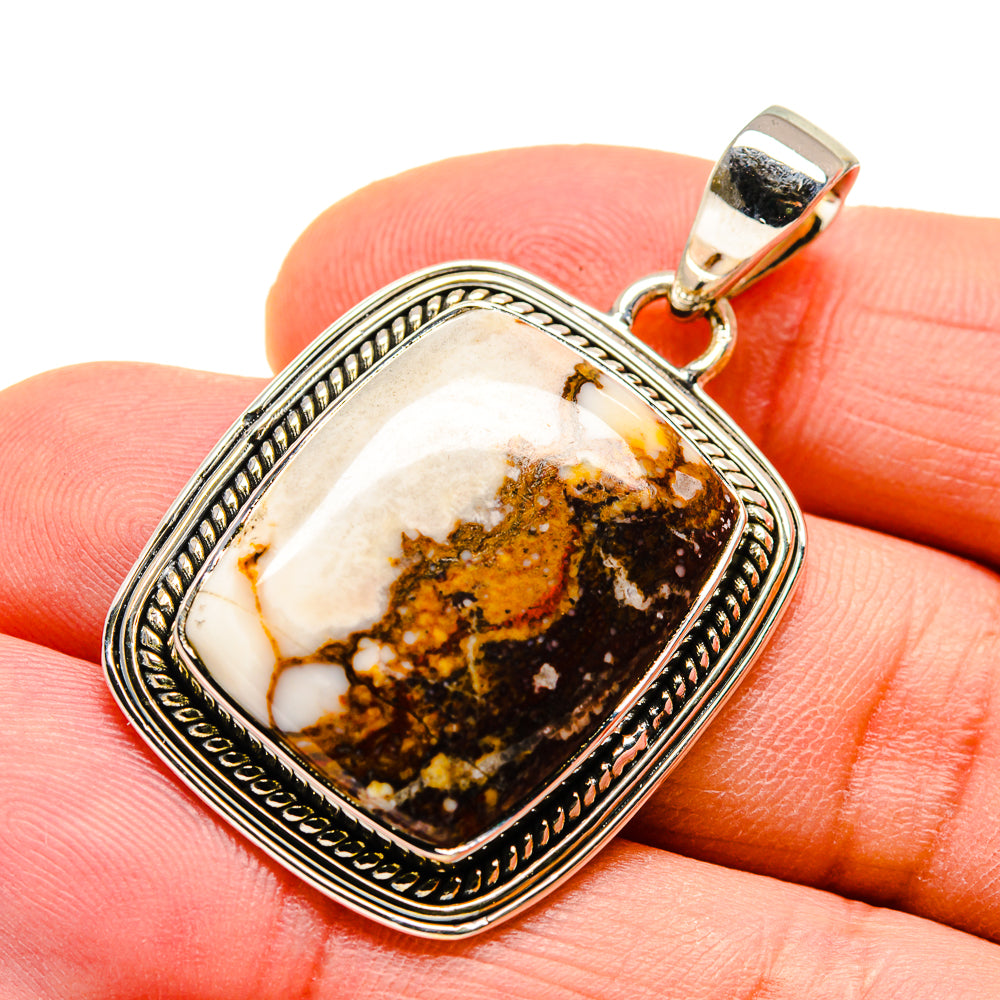 Sterling silver pendant with rectangular peanut jasper stone and ornate bezel, hinged bail