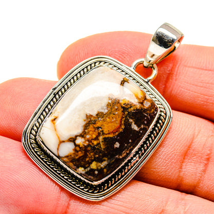 Sterling silver pendant with rectangular peanut jasper stone and ornate bezel, hinged bail
