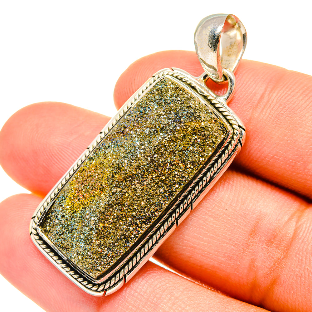 Druzy pyrite pendant in rectangular bezel with silver border and bail, yellow-gold sparkle.