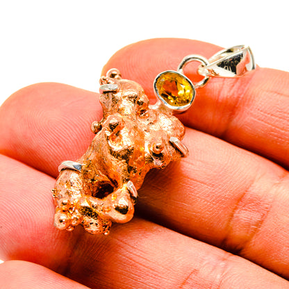 Copper splash pendant with round citrine cabochon in sterling silver setting