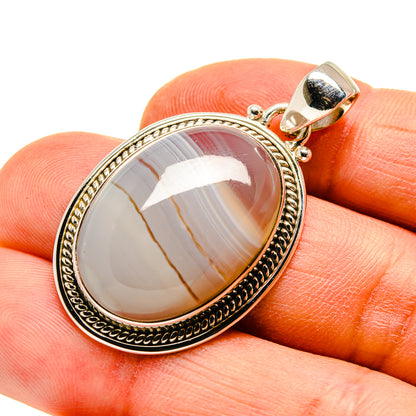 Oval Botswana agate pendant, white-gray banded stone in sterling silver bezel