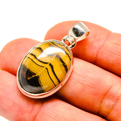 Oval tiger's eye pendant on sterling silver bail with 925 bezel