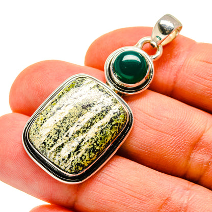 Sterling silver pendant with rectangular green-and-white stone and round green cabochon