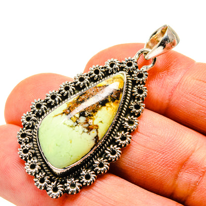 Chrysoprase pendant with teardrop green stone and ornate silver flower bezel