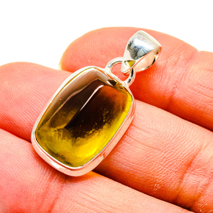 Sterling silver olive quartz pendant close-up, oval cabochon with top bail