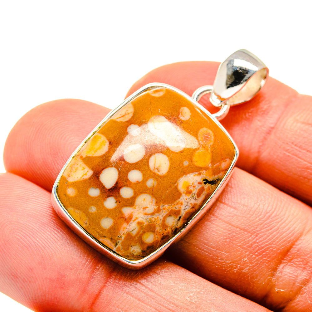 Mookaite stone pendant in 925 sterling silver bezel, orange with white spots.
