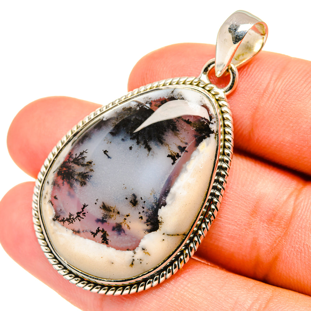 Teardrop opal pendant with white stone, dark dendrite inclusions, rope-textured silver bezel